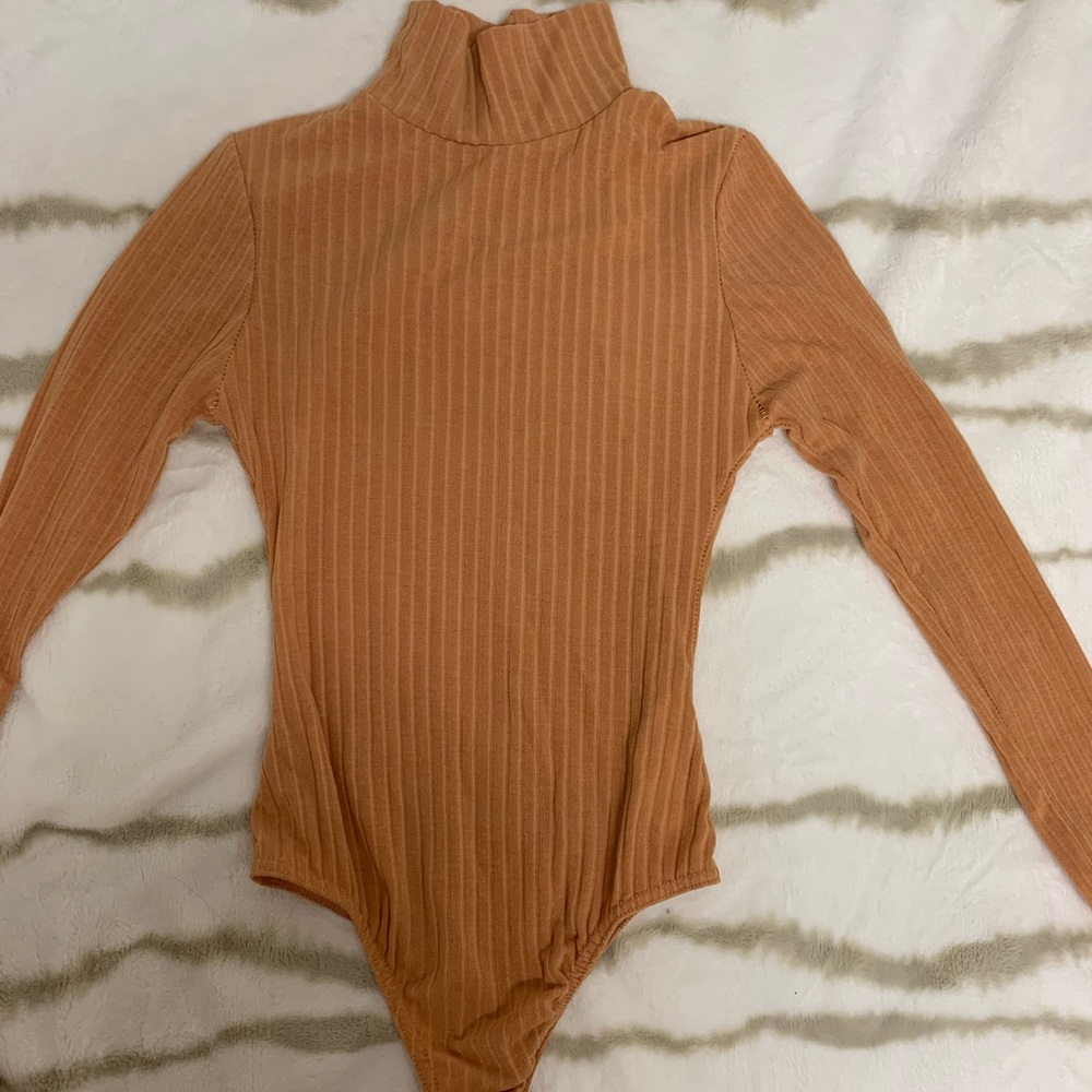 tan turtleneck shirt